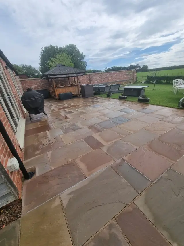 Sandstone patio after pressure washing by The Green Team
