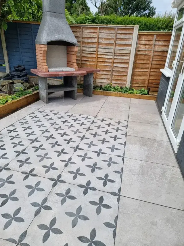 Patterned porcelain patio with outdoor pizza oven – The Green Team, Shropshire
