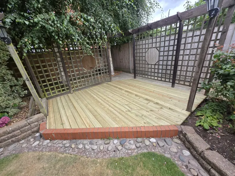 Timber garden decking installation by The Green Team Landscaping Services