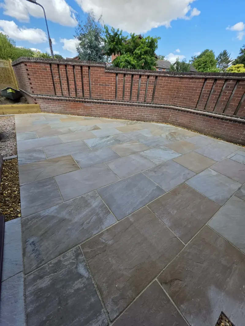 Indian sandstone patio installation with gravel edging in Shropshire